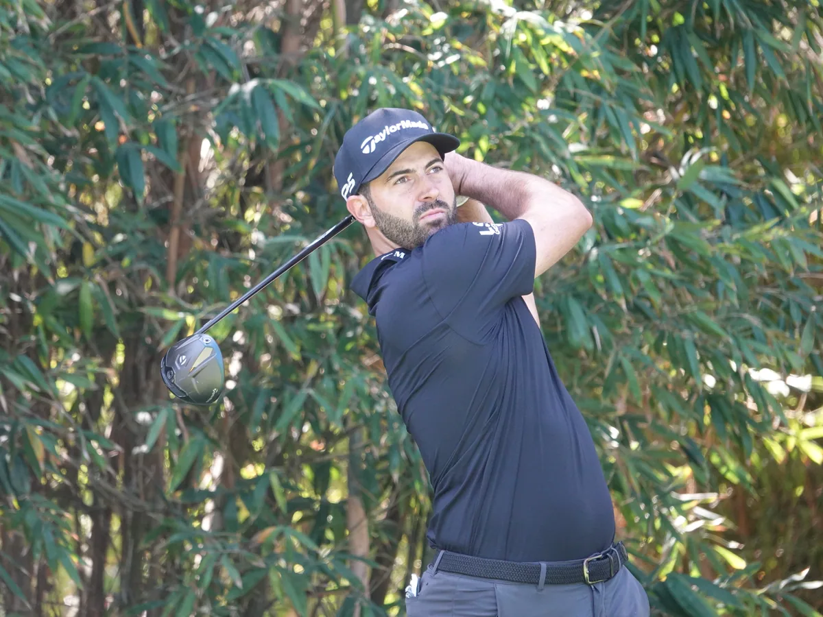 Joey Savoie following a tee shot